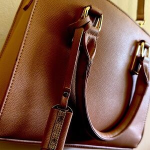 stunning brown purse with a adjustable shoulder strap